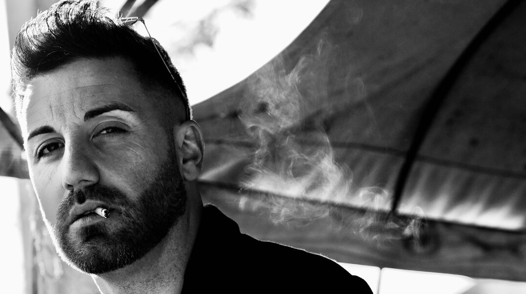 Man with short beard portrait looking at camera