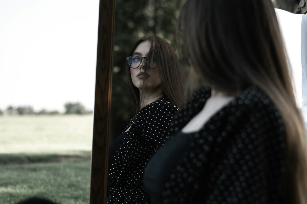 woman practicing speech in mirror